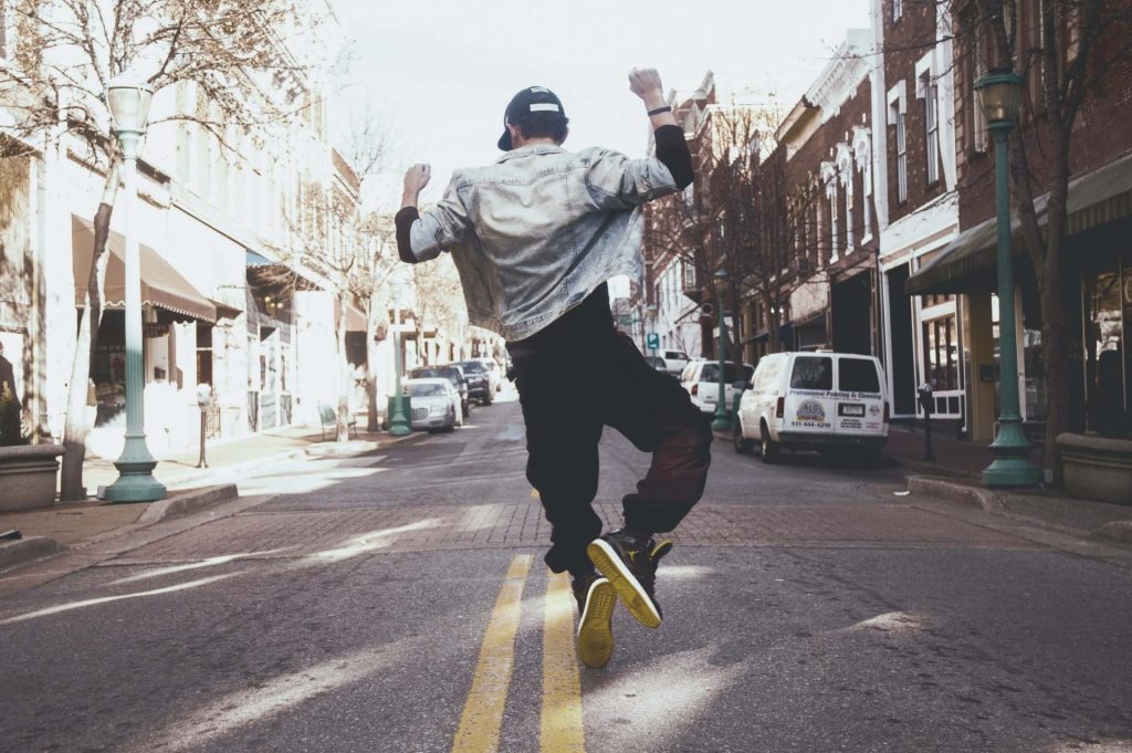 man jumping | depression counseling in parkland, fl | depression counseling in coconut creek, fl | anxiety therapy in parkland, fl | anxiety therapist in parkland, fl | anxiety therapy in coconut creek, fl | online therapy in parkland, fl | 33073 | 33067 | 33076 Image of a man happily jumping up in the air in the middle of the street. Break free from your stress with the help of anxiety therapy in Parkland, FL.