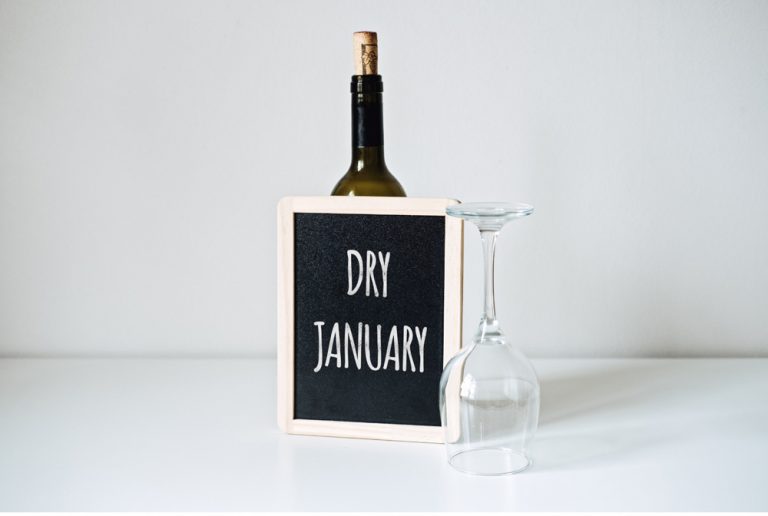 picture of wine bottle and glass with board that says dry January, alchohol abuse therapy, parkland, fl