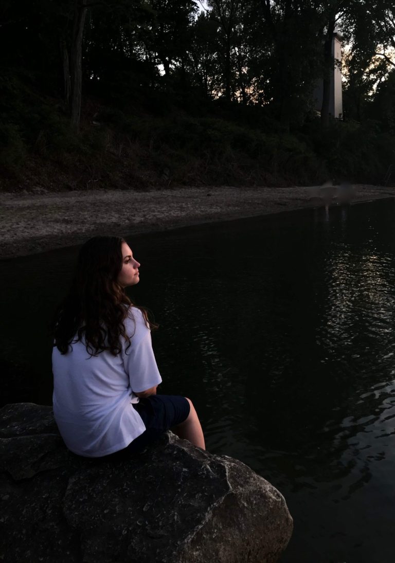Photo of a woman sitting by a dark lake looking out in the distance. Are you struggling from depression after breakup? Discover how depression counseling in Coconut Creek, FL can help you overcome your symptoms and move forward.