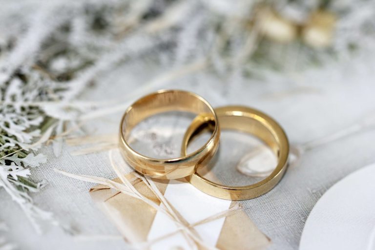 Image of two gold wedding bands linked together. Struggling with pre-wedding depression? Discover how depression counseling in Parkland, FL can help you cope.