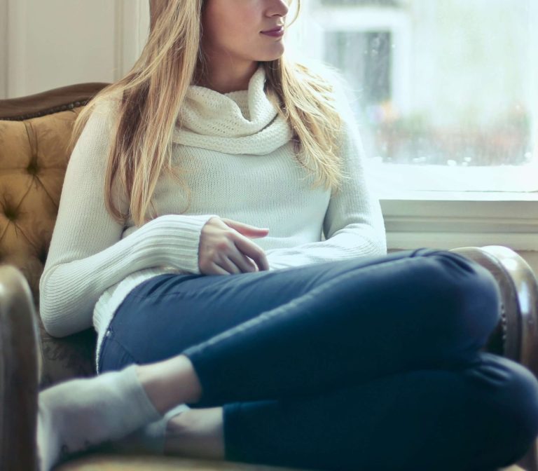 Image of a woman sitting in a chair looking out a window. Discover how depression counseling in Parkland, FL can help you effectively cope with your depression symptoms.