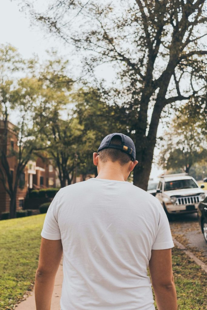 baseball cap | depression counseling in parkland, fl | depression therapist in parkland, fl | major life changes | cbt therapy | signs of depression | 33073 | 33067 | 33076 Image of a man wearing a baseball cap walking down a sidewalk. Learn to recognize if depression is affecting your daily life and work with a skilled depression therapist in Parkland, FL to begin identifying patterns.