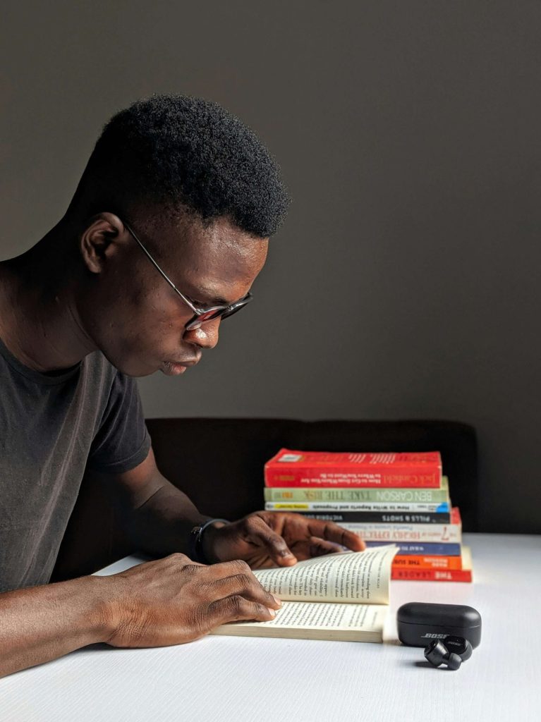 books | depression counseling in parkland, fl | depression therapist in parkland, fl | major life changes | cbt therapy | signs of depression | 33073 | 33067 | 33076 Image of an African American man sitting at a desk reading a book with a stack of books beside him. If you are unable to live your life due to depression, learn how depression counseling in Parkland, FL can help!