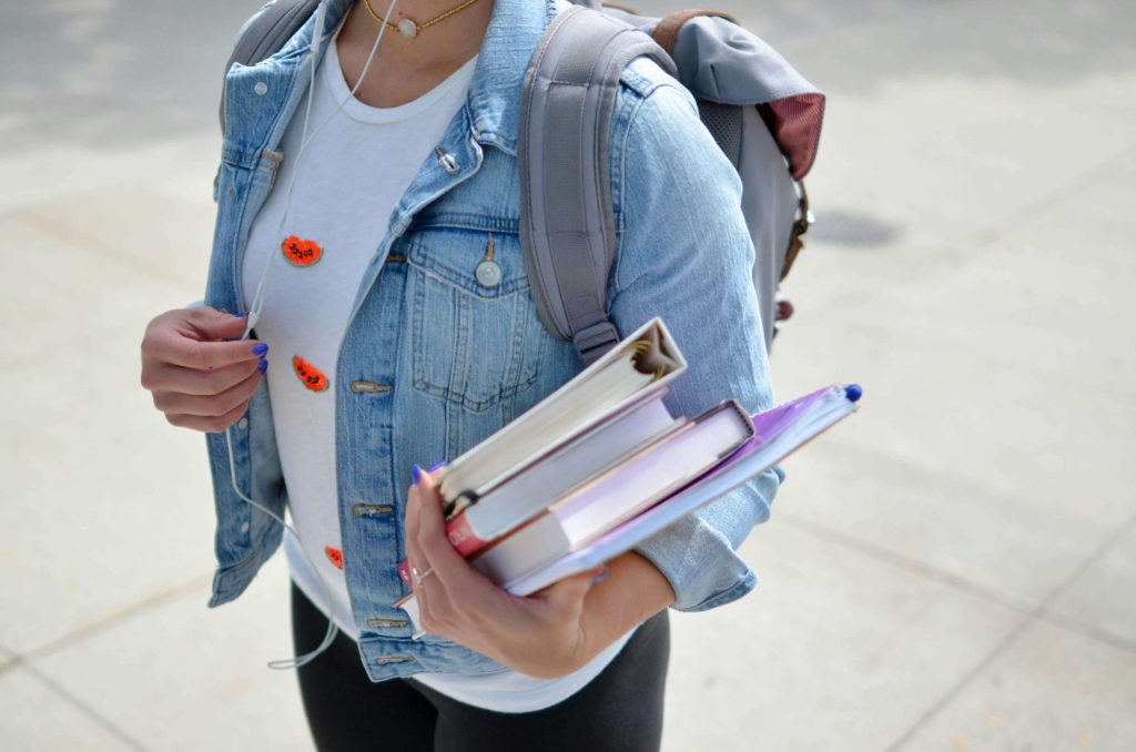backpack | anxiety therapy in coconut creek, fl | anxiety therapist in coconut creek, fl | depression counseling | signs of depression | college student anxiety | 33063 | 33066 | 33073 Image of a college student wearing headphones and a backpack while holding books. Discover how anxiety therapy in Coconut Creek, FL can help you overcome your college student anxiety.