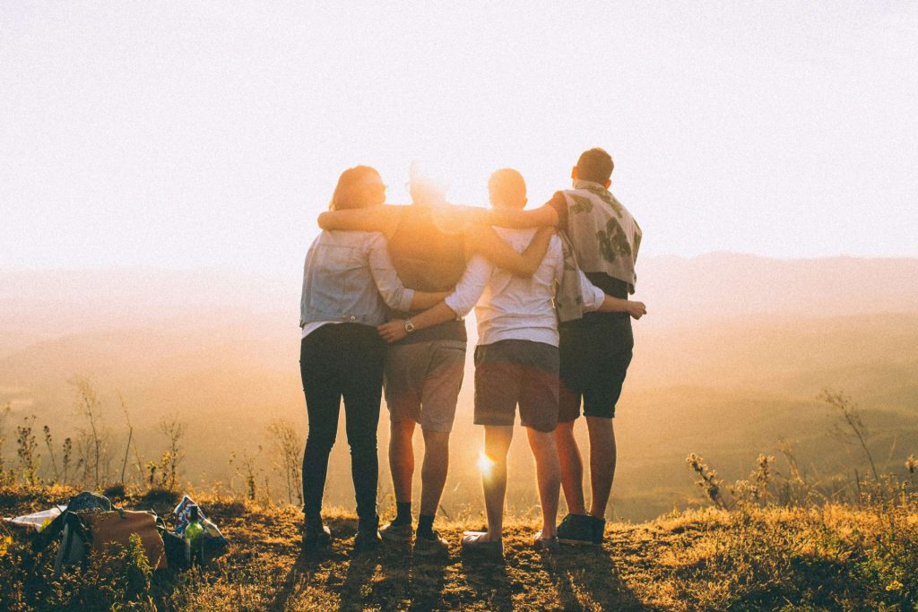 friends hugging | anxiety therapy in coconut creek, fl | anxiety therapist in coconut creek, fl | depression counseling | signs of depression | college student anxiety | 33063 | 33066 | 33073 Image of a group of college student friends hugging and while standing on a hill looking at the sunset. If you struggle with college student anxiety, work with a skilled anxiety therapist in Coconut Creek, FL to overcome it.