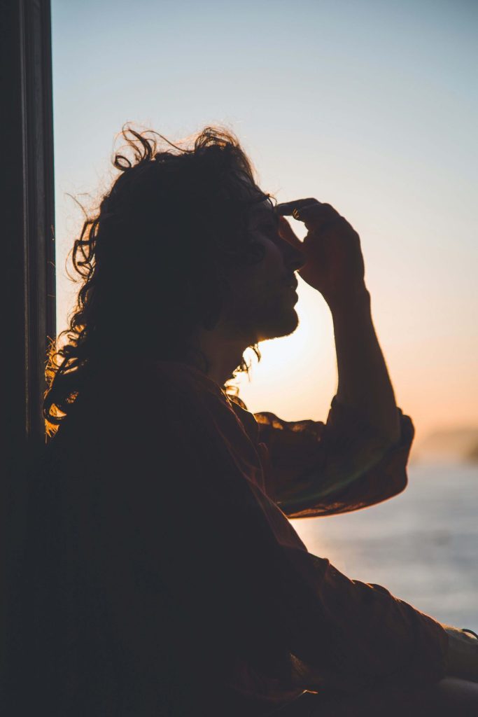 man and sunset | anxiety therapy in coconut creek, fl | cbt for anxiety in coconut creek, fl | anxiety therapist | cbt therapist | cbt therapy | 33063 | 33066 | 33073 Image of a stressed man moving hair out of his face as the sun sets behind him. Begin to overcome your anxiety symptoms due to life transitions with the help of a skilled CBT therapist. Start CBT for anxiety in Coconut Creek, FL soon.